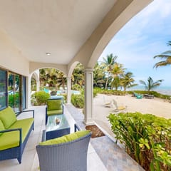 Ground-floor ocean-view condo with dock, pool, full kitchen, & AC