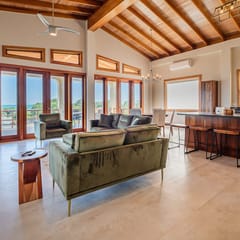 Tropical retreat villa with a pool, dock, bikes, canoes, balconies, and 360 views