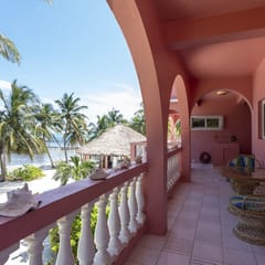 Breezy 2-story oceanfront condo with pool, sea views & partial AC