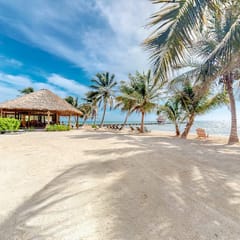 Ocean-view studio with pool, WiFi & partial AC - steps from the beach