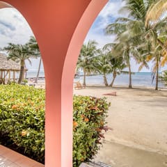 Beachfront condo w Caribbean Sea view, shared pool & dock, partial AC & WiFi