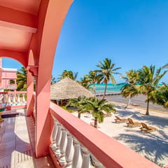 Beachfront condo with beach access, dock, pool, balcony, & ocean views