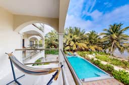 Beachfront condo with balcony, sea view, partial AC, pool, dock & kayaks - Image 2