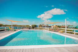 Beautiful lake-view villa with balcony, pool, & partial AC - near dining & shops - Image 4
