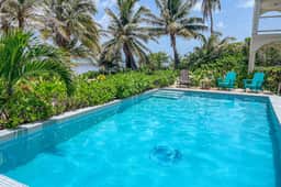 Colorful oceanfront condo with shared pool and jetted tub - Image 3