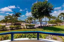 Charming Apartment with Idyllic Waterfront Views and Outdoor Pool Access - Image 2