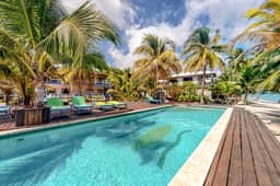 Ocean view condo with shared pool, WiFi, & central AC - steps to beach - Image 3