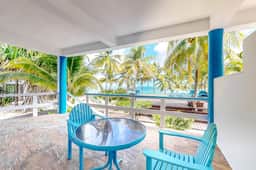 Charming, beachfront condo with shared outdoor pool, central AC, & free WiFi - Image 2