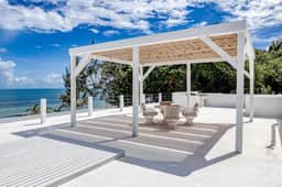 Luxurious beachfront home with private pool, rooftop grill, and sea views - Image 3