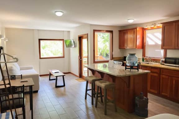 Scenic retreat on the beach with a balcony - pool, grill, dock, and canoe access - Image 3