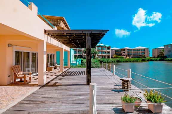 Cozy Waterfront Villa Home w Shared Pool, Water Views, WiFi, & AC - Walk to the Beach - Image 2