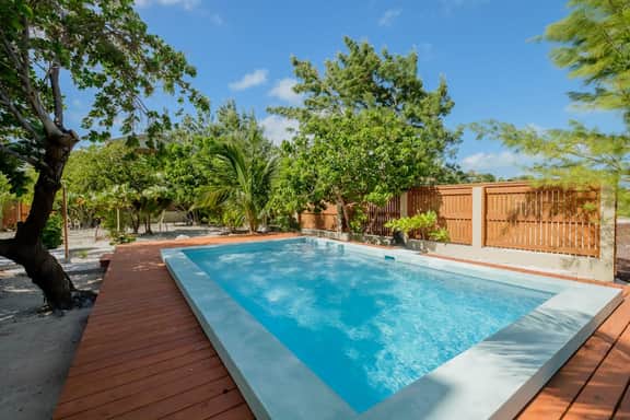 Beachfront abode with well-equipped kitchen - pool, beach, grill, & canoe access - Image 2
