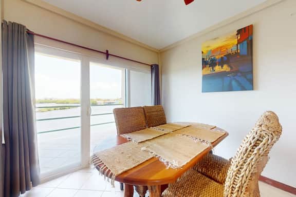 Sunny waterfront villa with outdoor pool, balcony, & AC - Image 4