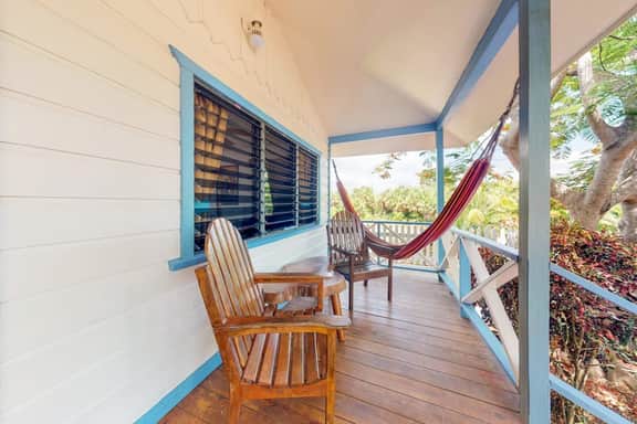 Cabana with a porch, hammock, & view of the pool & grilling area - Image 2