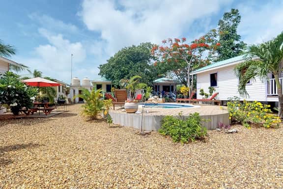 Cabana with a porch, hammock, & view of the pool & grilling area - Image 3
