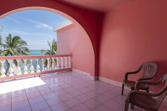 Breezy 2-story oceanfront condo with pool, sea views & partial AC - Image 5