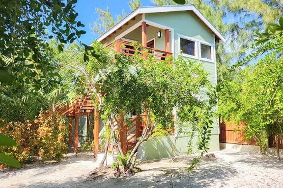 Scenic retreat on the beach with a balcony - pool, grill, dock, and canoe access - Image 1