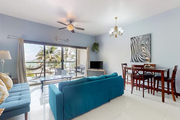 Beachfront condo with balcony, sea view, partial AC, pool, dock & kayaks - Image 1