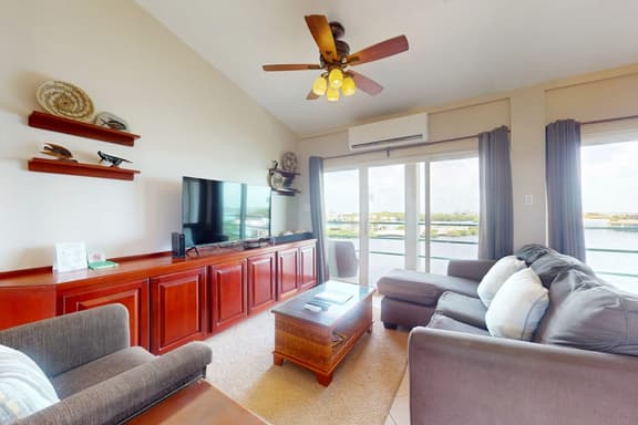 Sunny waterfront villa with outdoor pool, balcony, & AC - Image 1