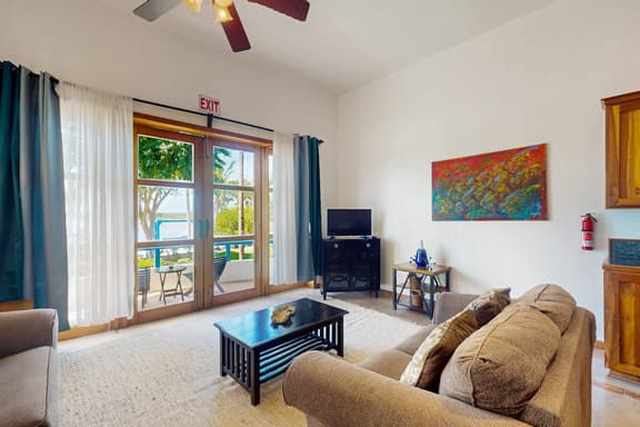 Charming Apartment with Idyllic Waterfront Views and Outdoor Pool Access - Image 1