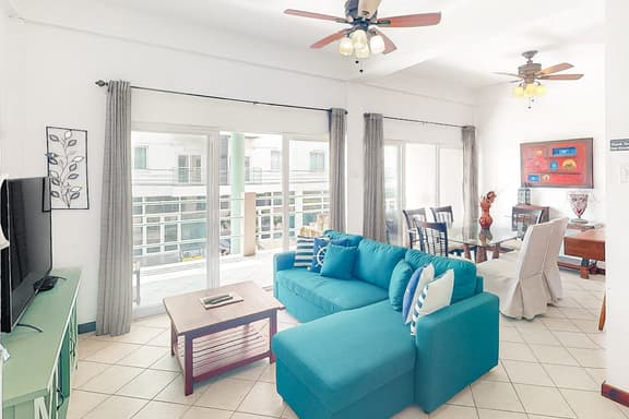 Stylish condo near the beach with pool, fast WiFi, partial ocean views & AC - Image 1