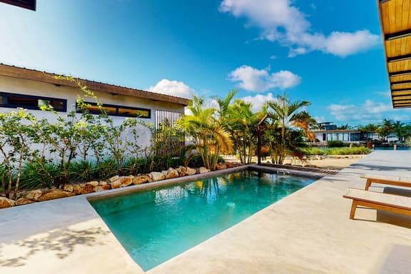 Elegant waterfront villa with private pool, terrace and beach club access - Image 1