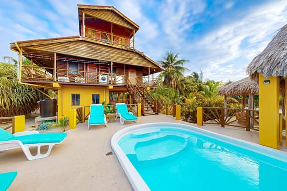 Waterfront villa with private pool, balcony, partial AC, fast WiFi - near beach - Image 1